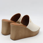 MULES À TALONS COMPENSÉES EN CUIR