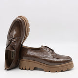 CHAUSSURES EN CUIR VERNIS ET SEMELLE CRANTÉE