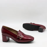 ESCARPINS À DOUBLES BOUCLES EN CUIR VERNIS